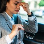 side-view-businesswoman-having-headache-car (1)
